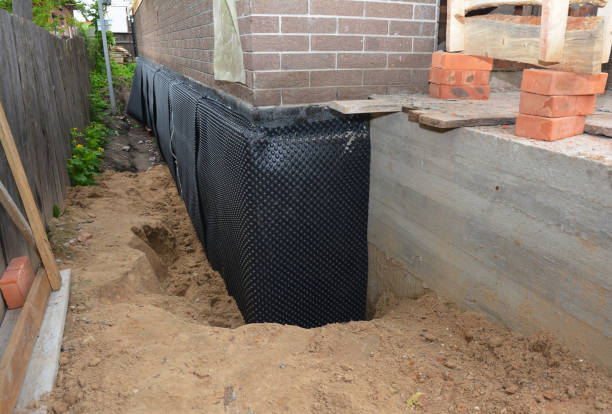 SJ Waterproofing Pros technician performing targeted Exterior Waterproofing assessment in Francesville, IN